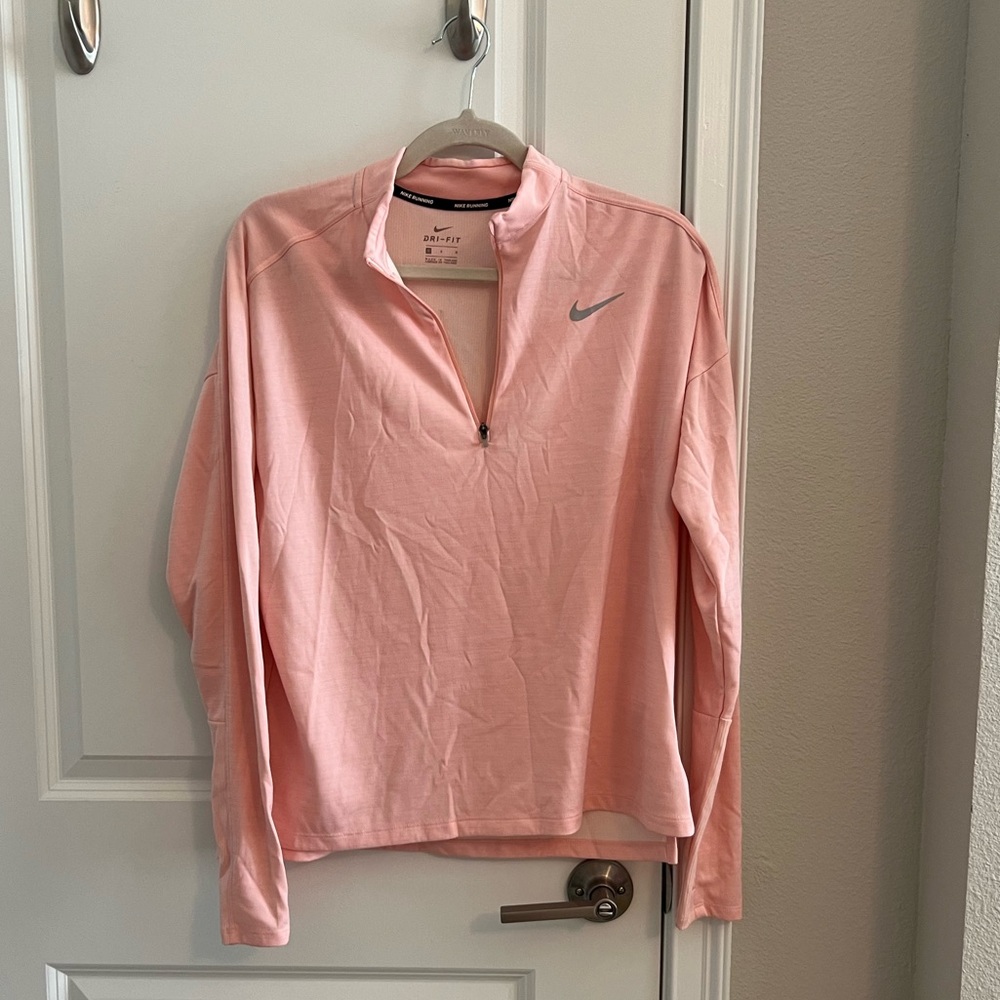 Light pink Nike dry fit pull over.